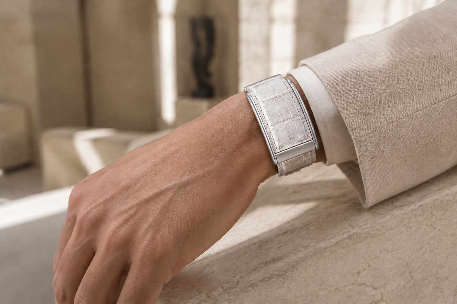 Wide Himalayan crocodile leather WHOOP strap worn with cream tailoring
